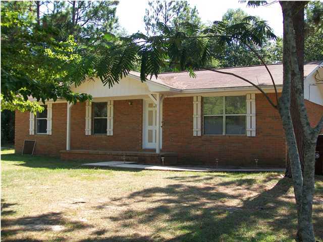 6193 Jonquil Street Crestview, FL 32539 - Photo 1 of 7 a view of a house with a yard