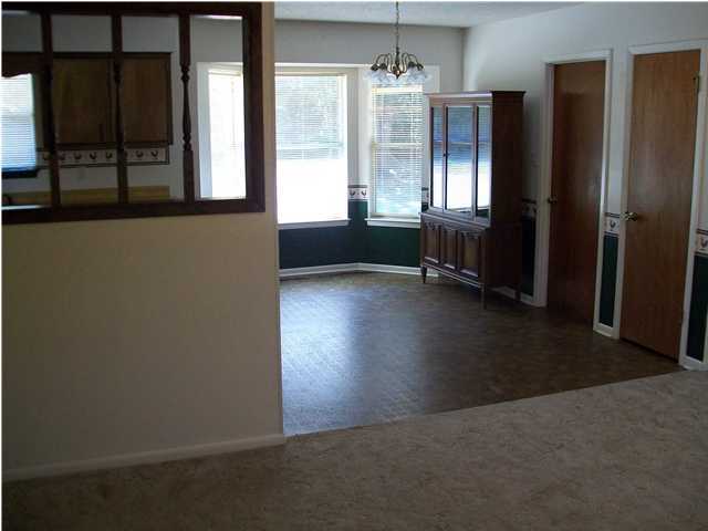 6193 Jonquil Street Crestview, FL 32539 - Photo 2 of 7 an empty room with windows and closet