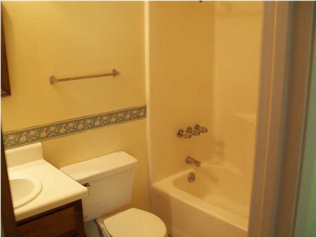 6193 Jonquil Street Crestview, FL 32539 - Photo 7 of 7 a bathroom with a toilet and a bathtub