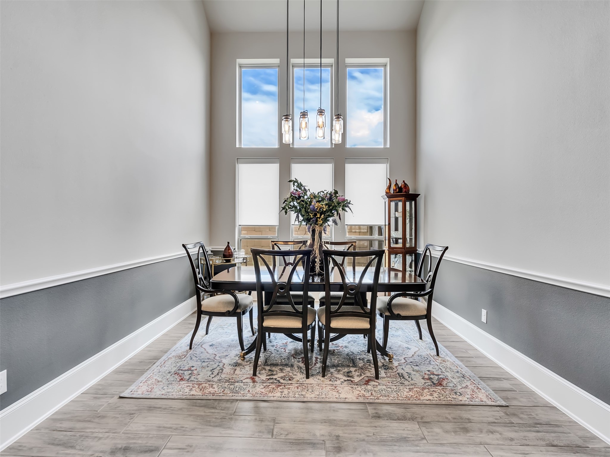 10302 Muir Peak Drive Rosharon, TX 77583 - Photo 6 of 40 Dining room area with large windows and chair rail moldings accent this rooms inviting atmosphere.