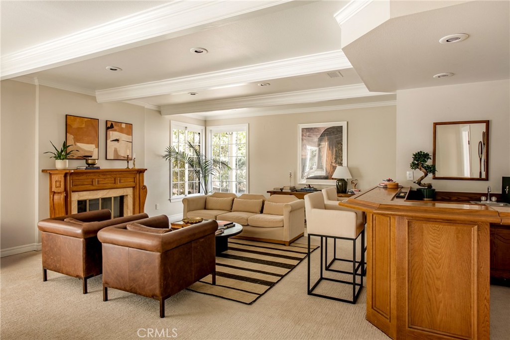 29528 Ridgeway Drive Agoura Hills, CA 91301 - Photo 14 of 41 a living room with furniture a fireplace and a flat screen tv