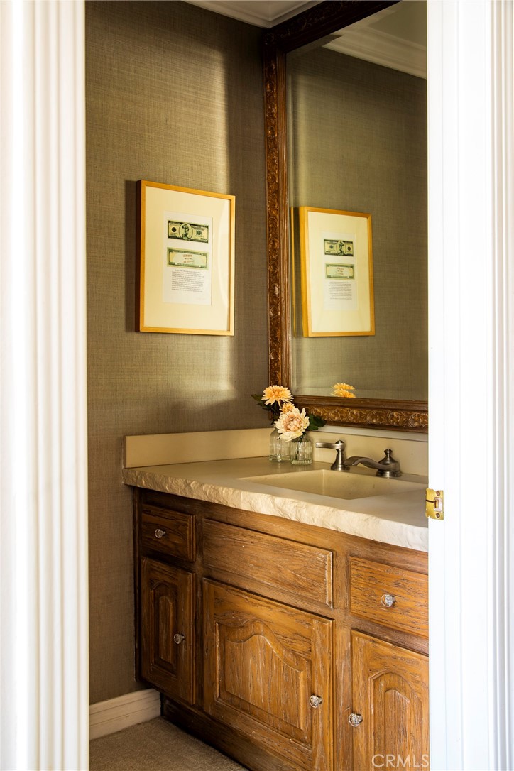 29528 Ridgeway Drive Agoura Hills, CA 91301 - Photo 16 of 41 a bathroom with a granite countertop sink and a mirror