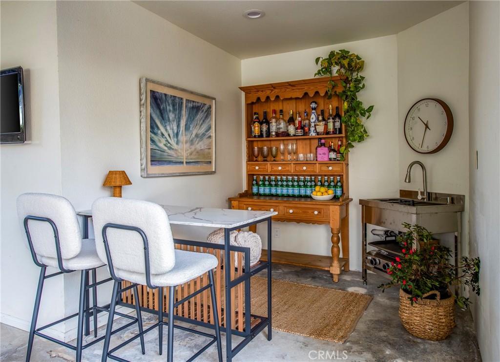 29528 Ridgeway Drive Agoura Hills, CA 91301 - Photo 33 of 41 a living room with furniture a rug and a floor to ceiling window
