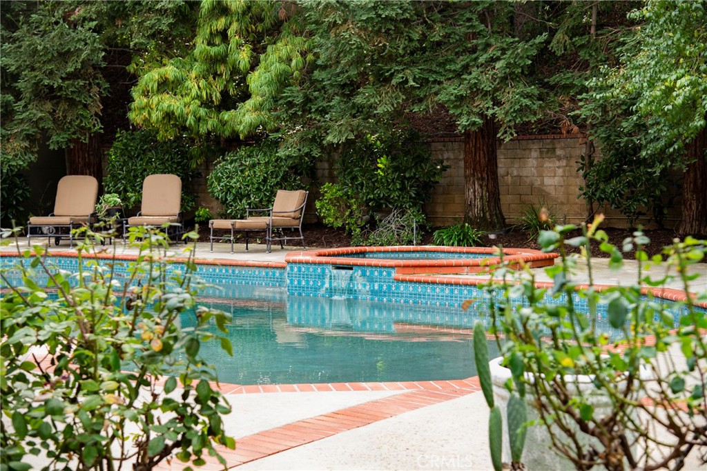 29528 Ridgeway Drive Agoura Hills, CA 91301 - Photo 37 of 41 a view of a yard with table and chairs