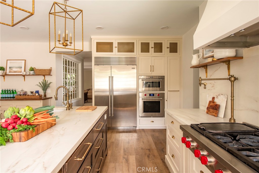 29528 Ridgeway Drive Agoura Hills, CA 91301 - Photo 8 of 41 a kitchen with stainless steel appliances granite countertop a stove and a refrigerator