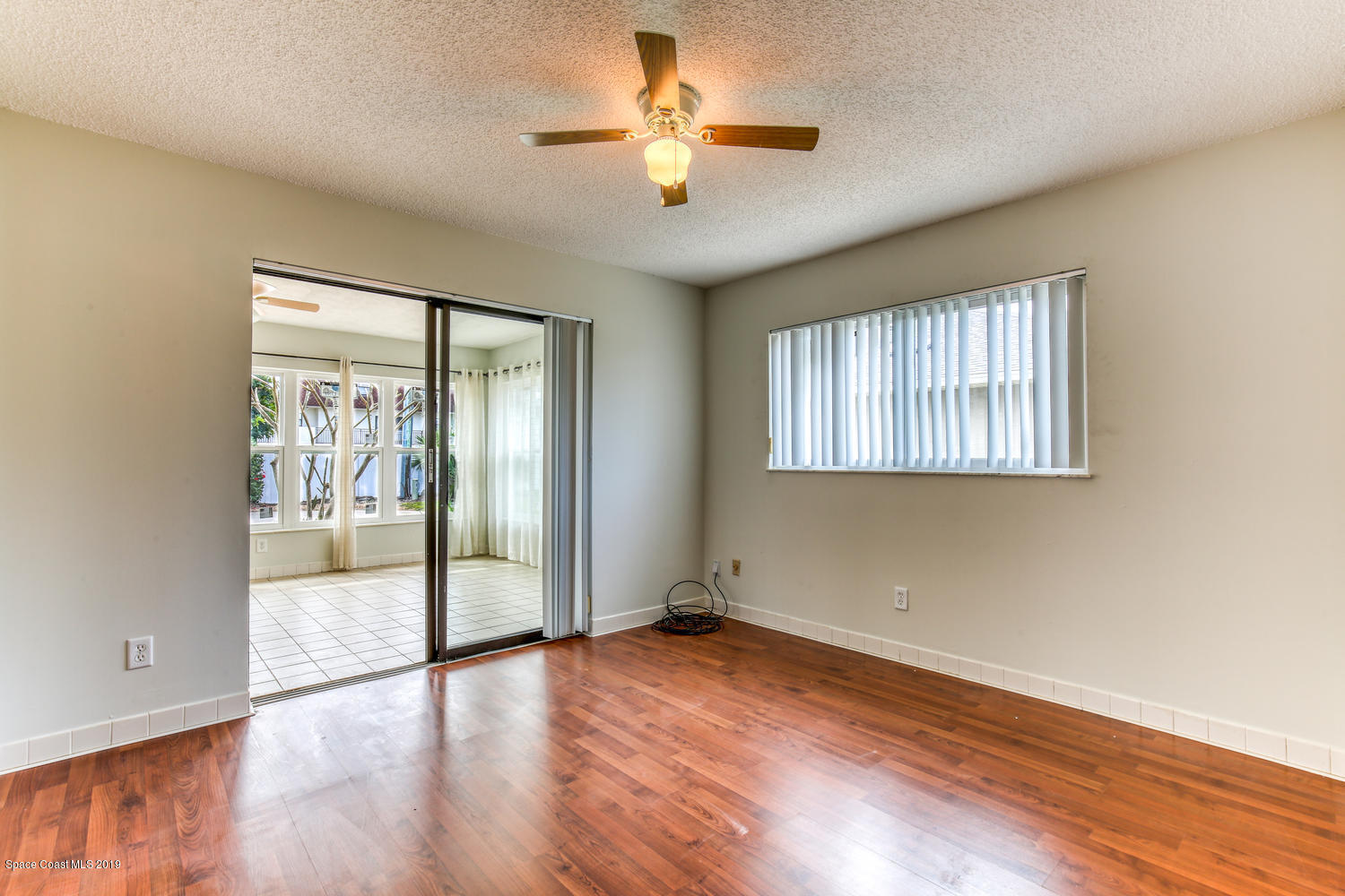 201 Ocean View Lane Melbourne, FL 32903 - Photo 14 of 21 wooden floor in an empty room with a window