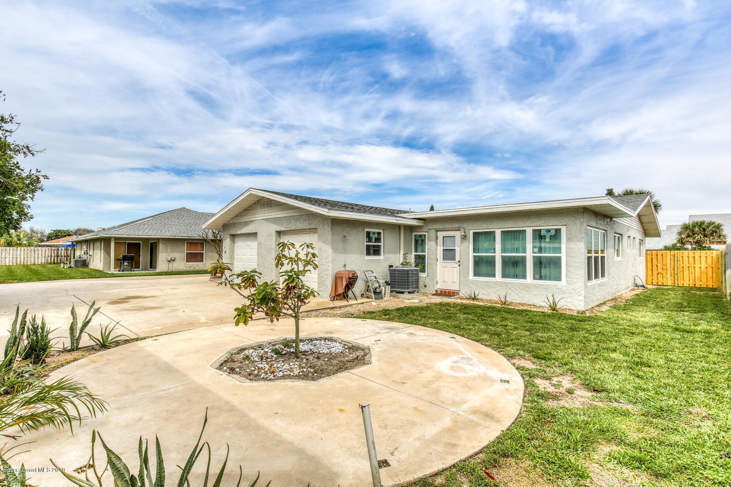 201 Ocean View Lane Melbourne, FL 32903 - Photo 17 of 21 a view of a house with yard and sitting area