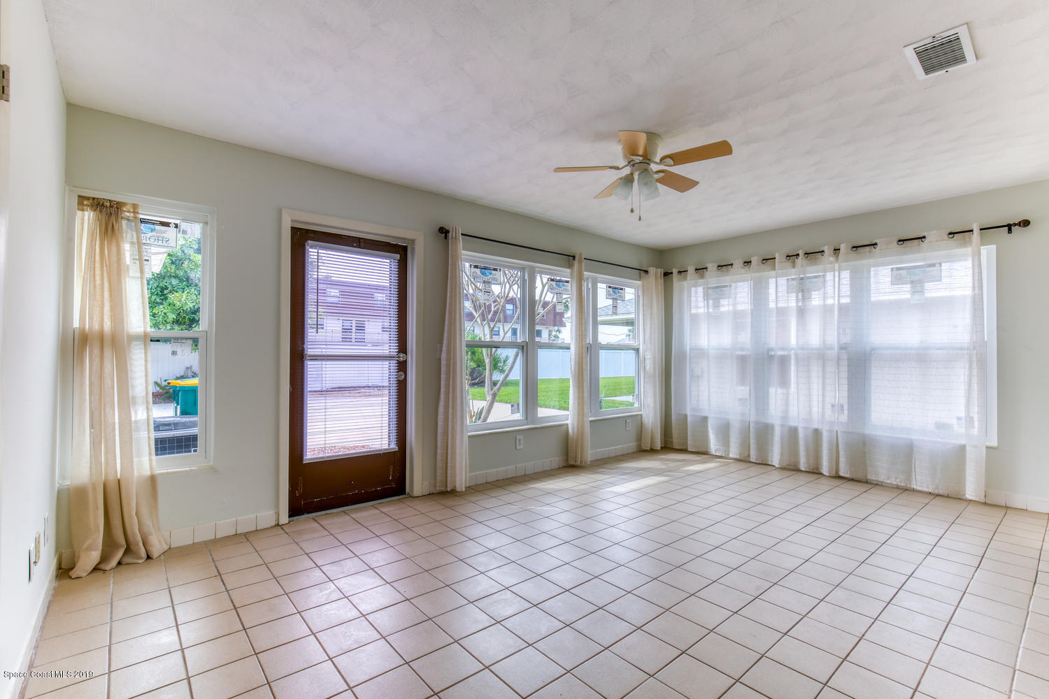 201 Ocean View Lane Melbourne, FL 32903 - Photo 6 of 21 a view of an empty room with a window