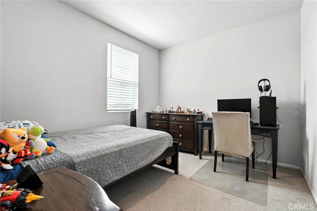 28267 Ashtree Street Temecula, CA 92591 - Photo 22 of 41 a bedroom with a bed and a window