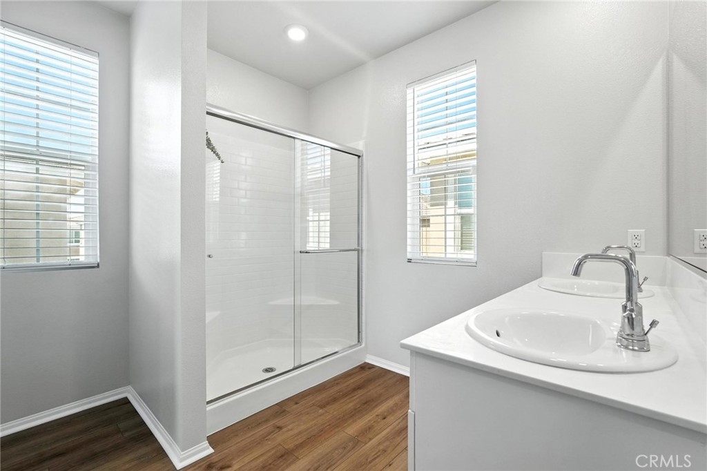 28267 Ashtree Street Temecula, CA 92591 - Photo 28 of 41 a bathroom with a sink and shower