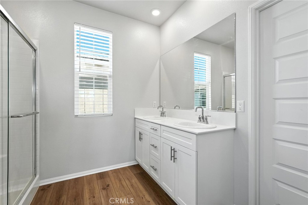 28267 Ashtree Street Temecula, CA 92591 - Photo 29 of 41 a bathroom with a sink and a mirror