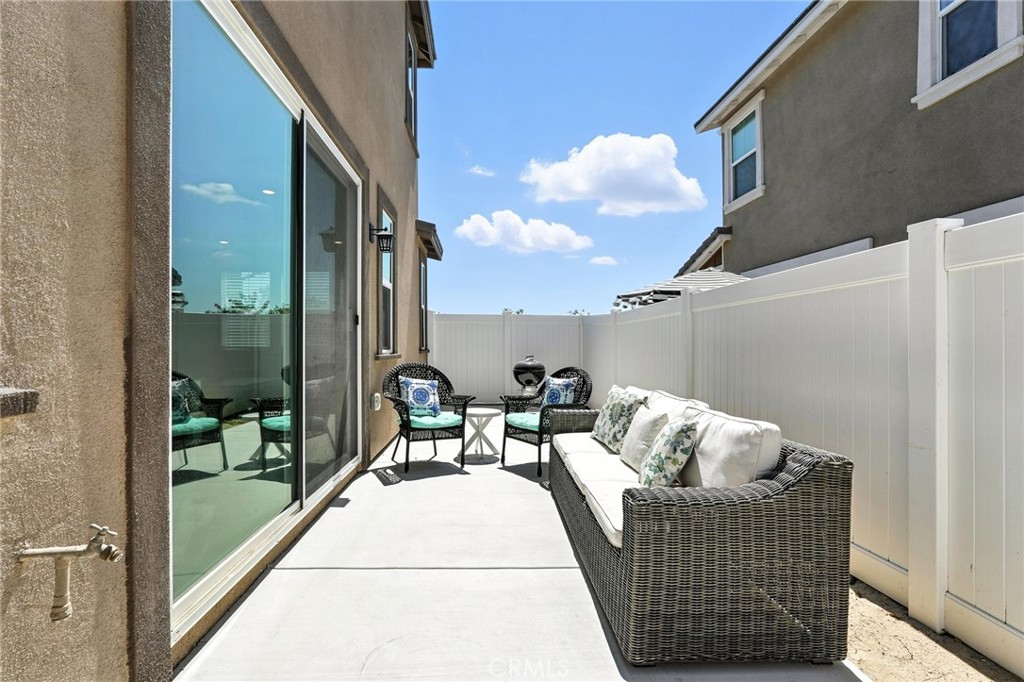 28267 Ashtree Street Temecula, CA 92591 - Photo 31 of 41 a balcony with furniture and a potted plant