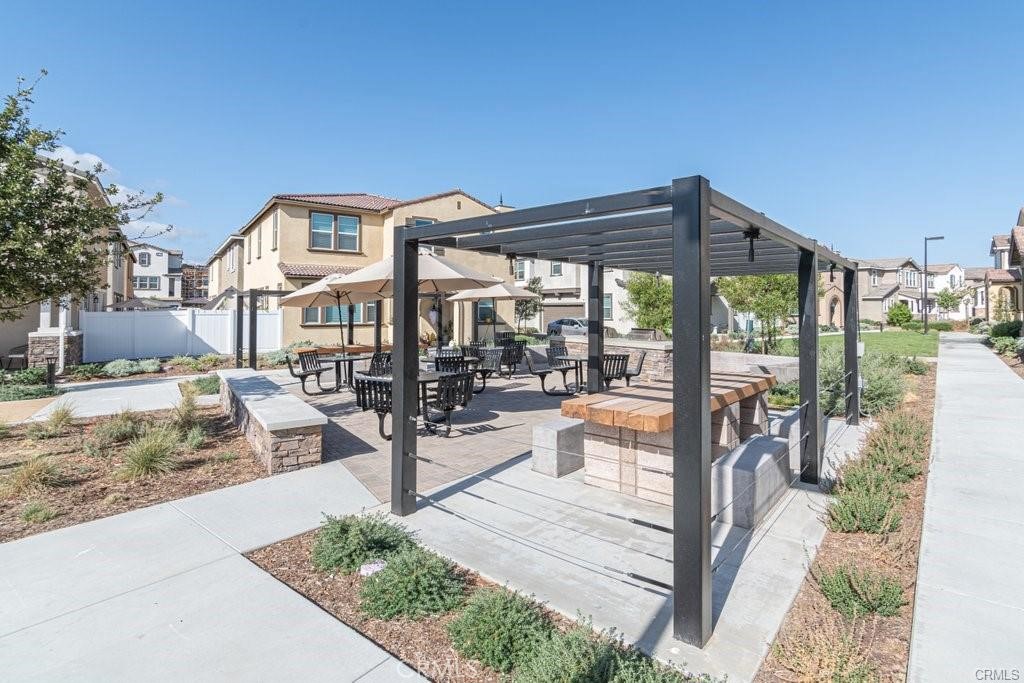 28267 Ashtree Street Temecula, CA 92591 - Photo 32 of 41 a view of a patio with a table and chairs