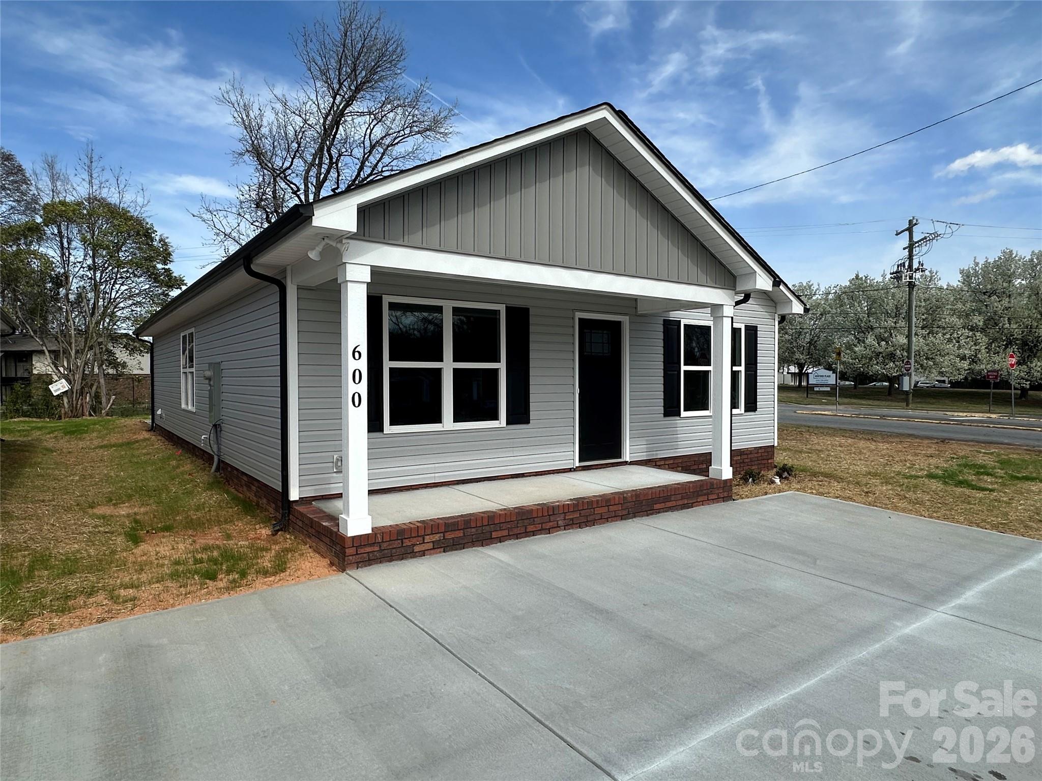 600 Bethpage Road Kannapolis, NC 28081 - Photo 2 of 3 a front view of a house with a yard and garage