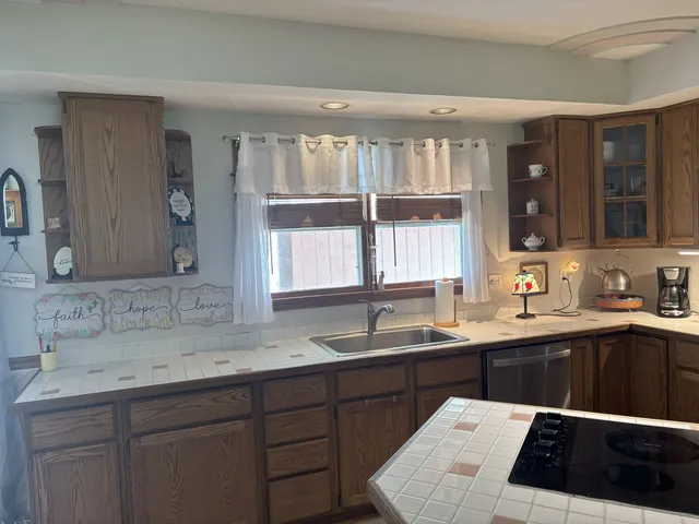 a kitchen with a sink and a window