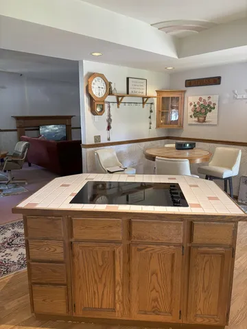 a kitchen with a stove and a cabinets