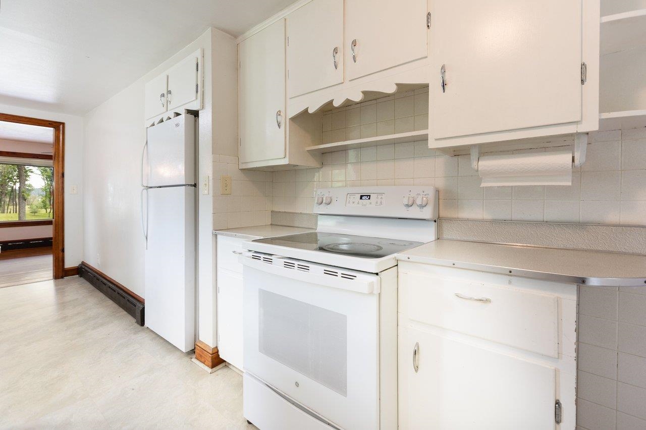 547 Grindstone Road Bridgewater, VA 22812 - Photo 13 of 57 a kitchen with cabinets and a stove top oven