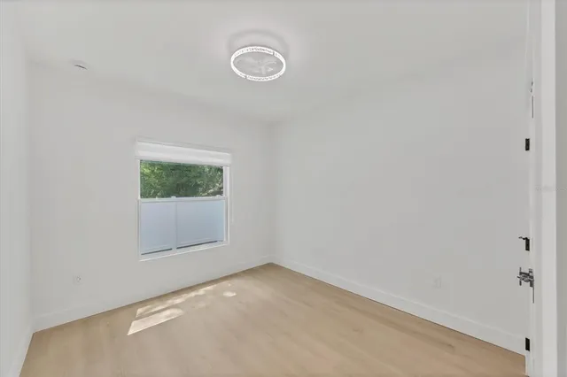 a view of a patio with a table and chairs
