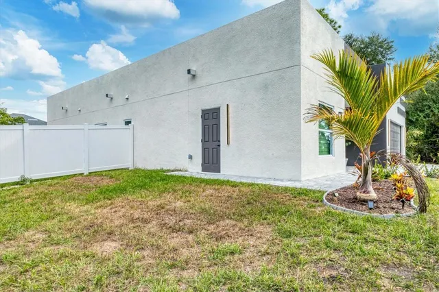 a aerial view of a house with a yard