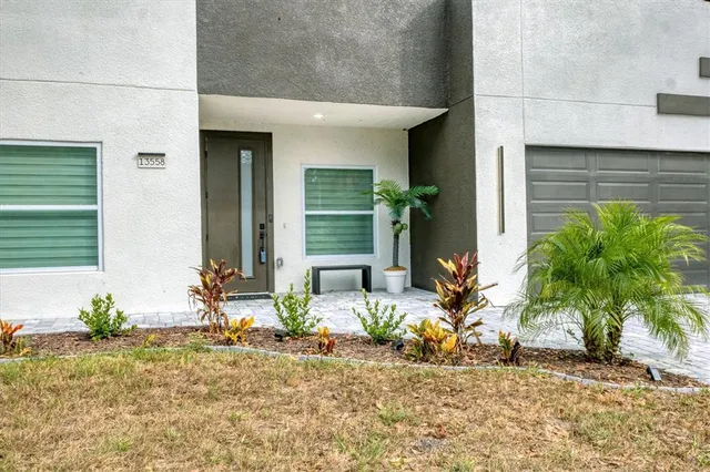a wooden bench sitting in front of a house