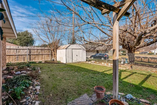 a view of a porch with furniture and a yard