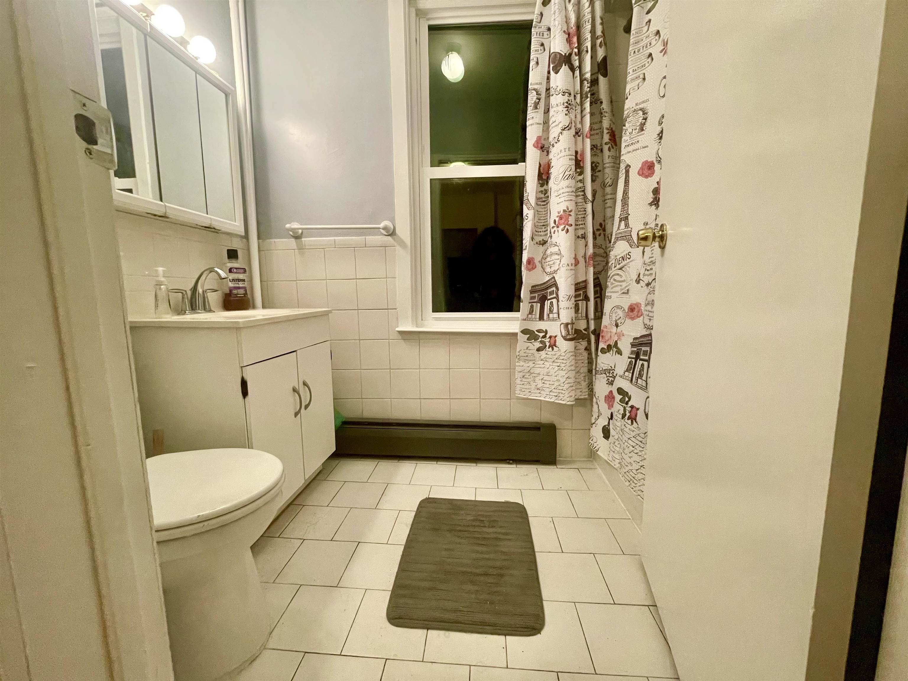 421 Adams Street, Unit 2L Hoboken, NJ 07030 - Photo 18 of 19 a bathroom with a sink and a mirror