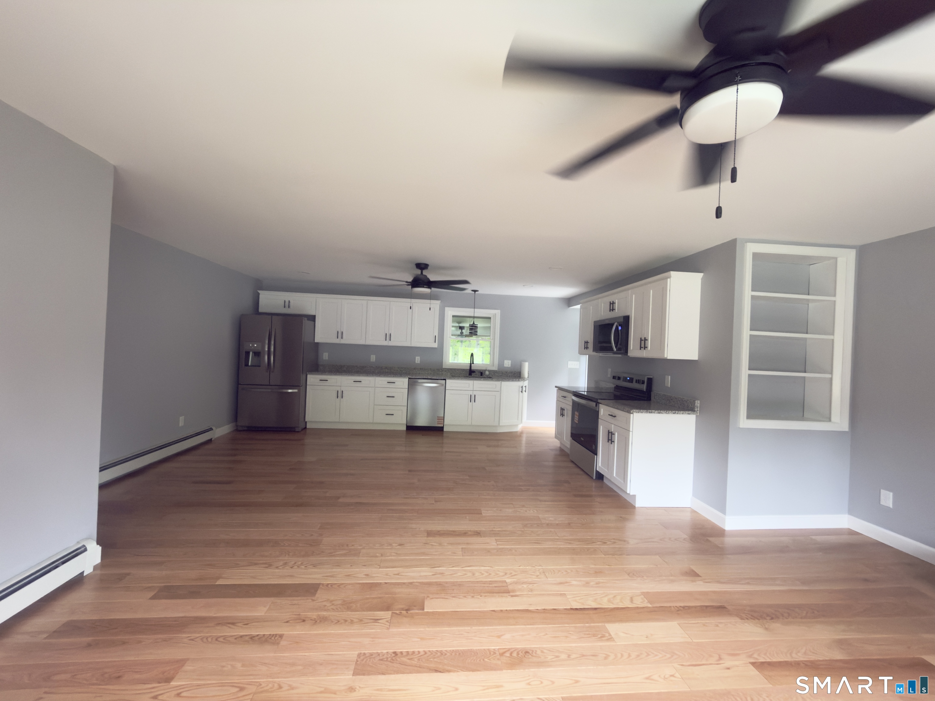 44 Polly Avenue Killingly, CT 06239 - Photo 7 of 22 a view of a living room hardwood and a kitchen