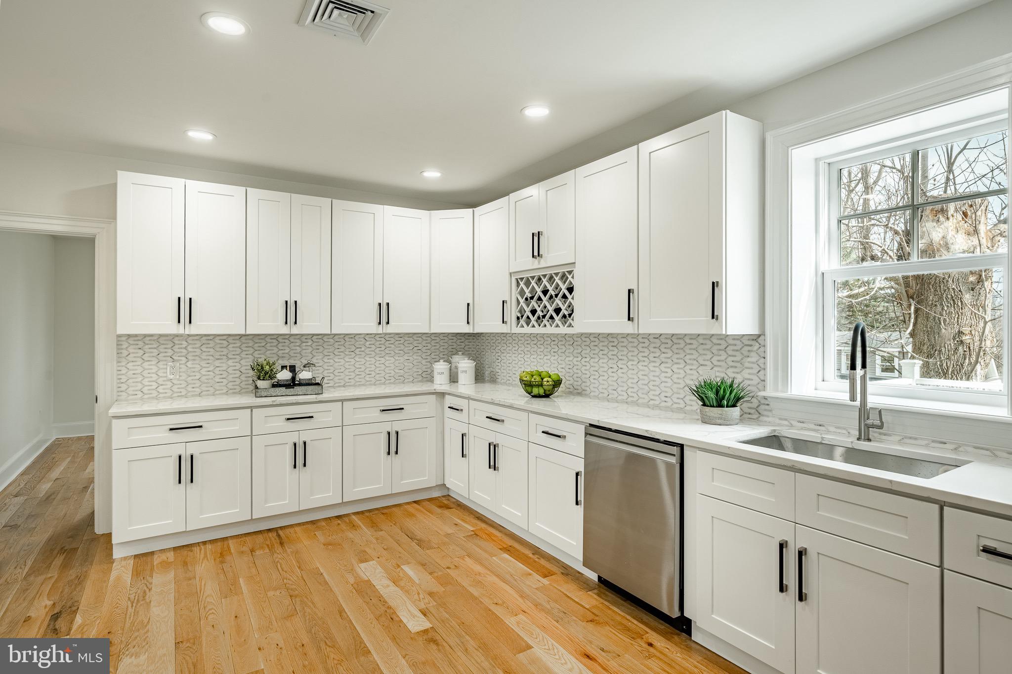 370 Boot Road West Chester, PA 19380 - Photo 11 of 56 a kitchen with a sink window and cabinets
