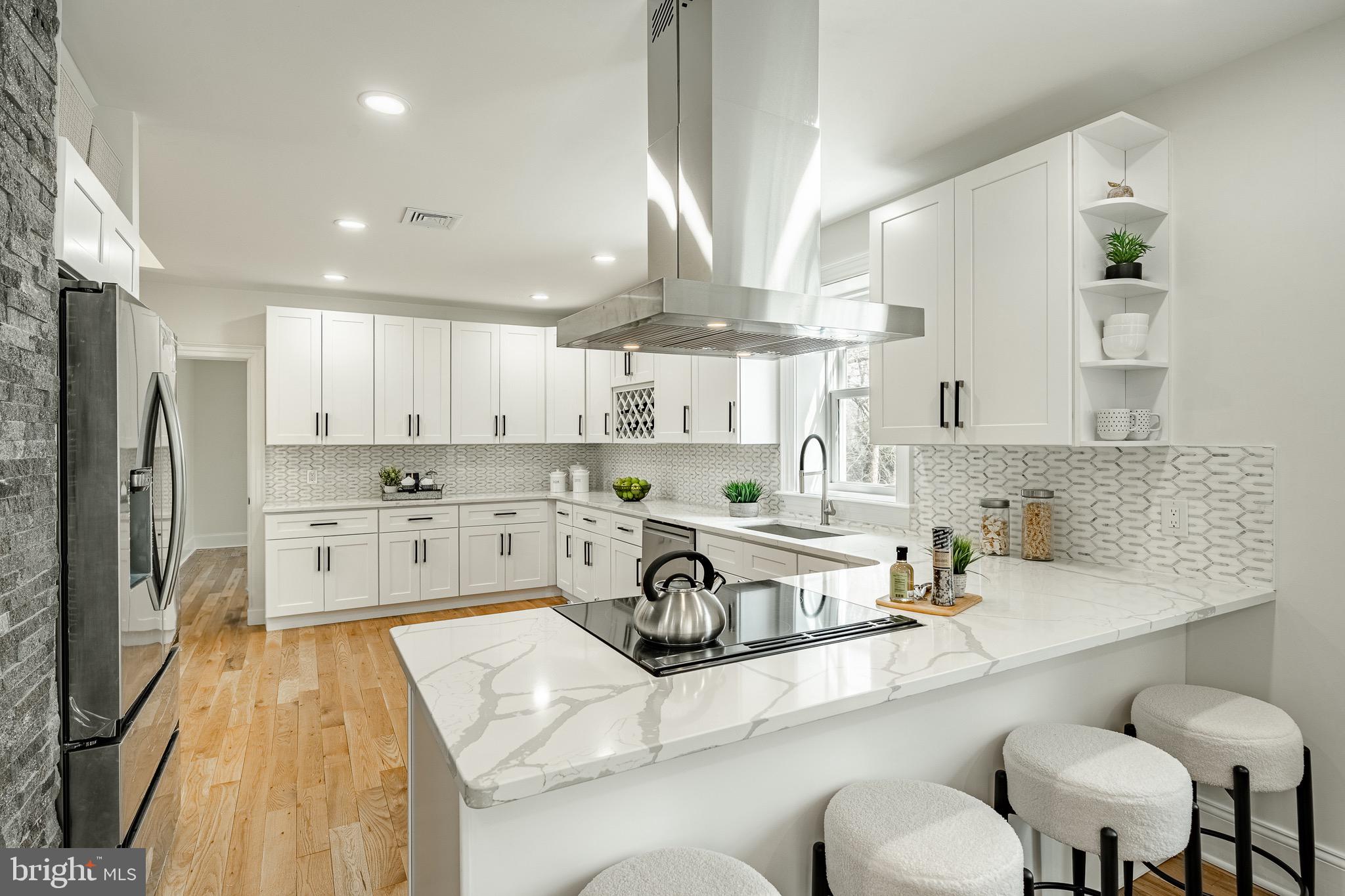 370 Boot Road West Chester, PA 19380 - Photo 13 of 56 a kitchen with stainless steel appliances granite countertop a sink a stove and a refrigerator