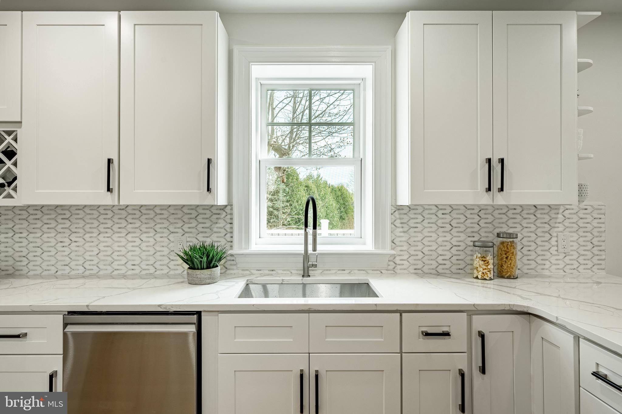370 Boot Road West Chester, PA 19380 - Photo 15 of 56 a kitchen with stainless steel appliances white cabinets and a window