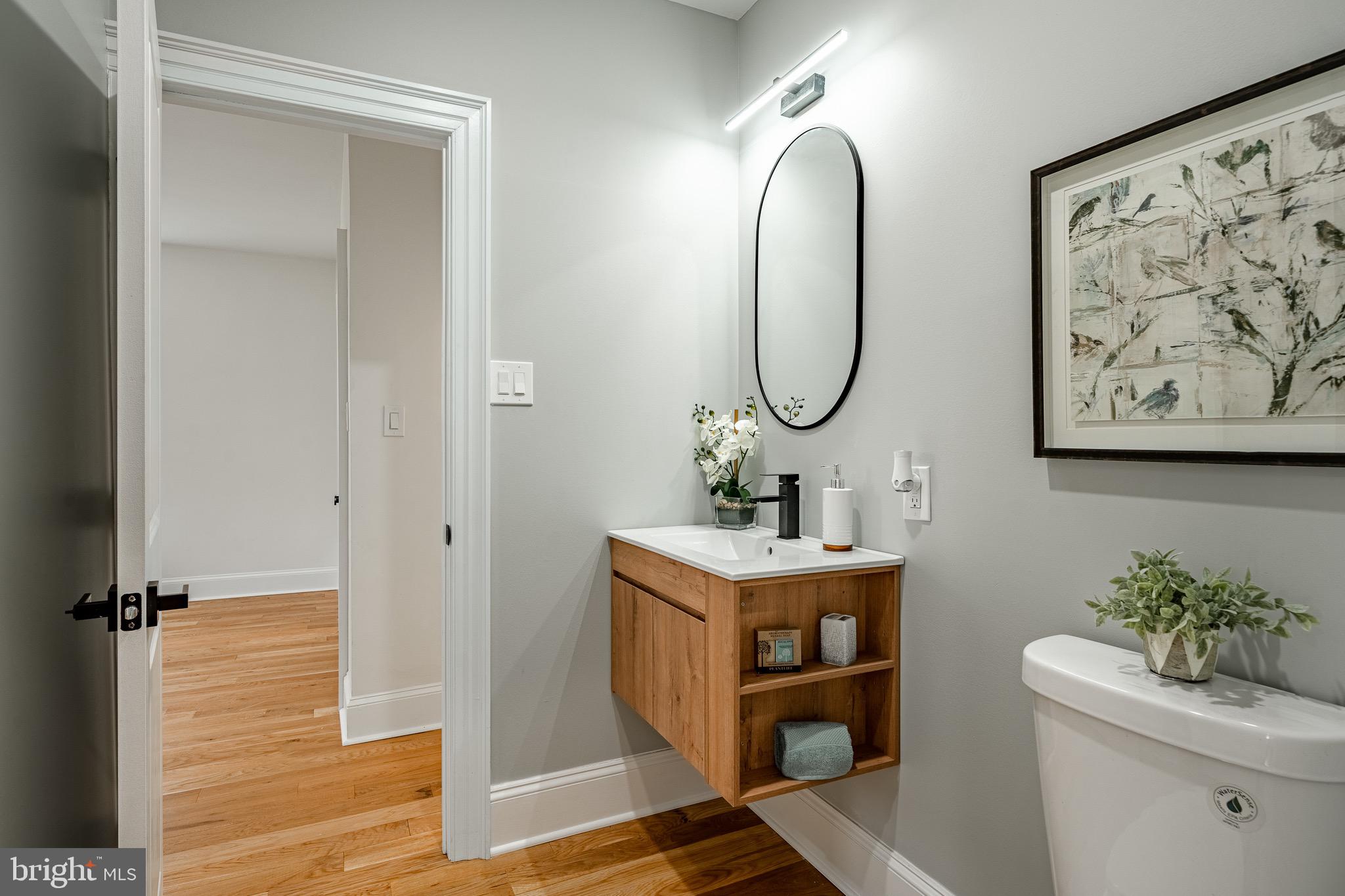 370 Boot Road West Chester, PA 19380 - Photo 17 of 56 a bathroom with a toilet a sink and mirror