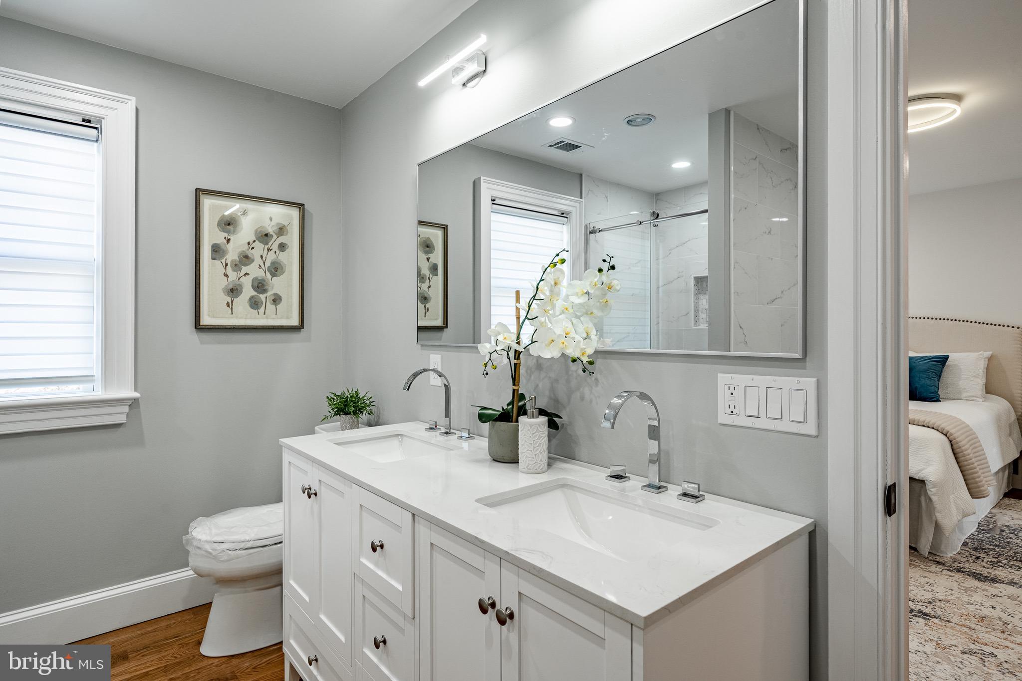 370 Boot Road West Chester, PA 19380 - Photo 25 of 56 a bathroom with a toilet sink and mirror