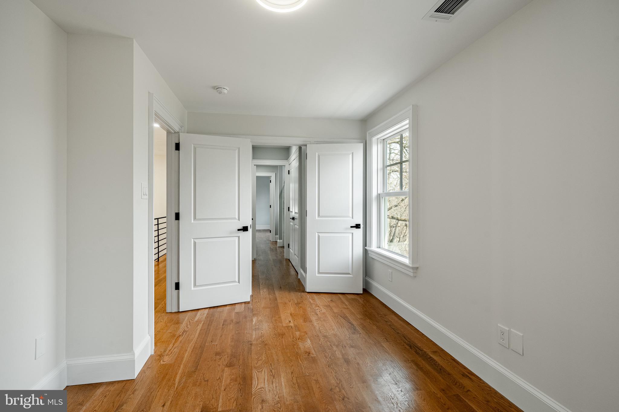 370 Boot Road West Chester, PA 19380 - Photo 26 of 56 a view of an empty room with a window and wooden floor
