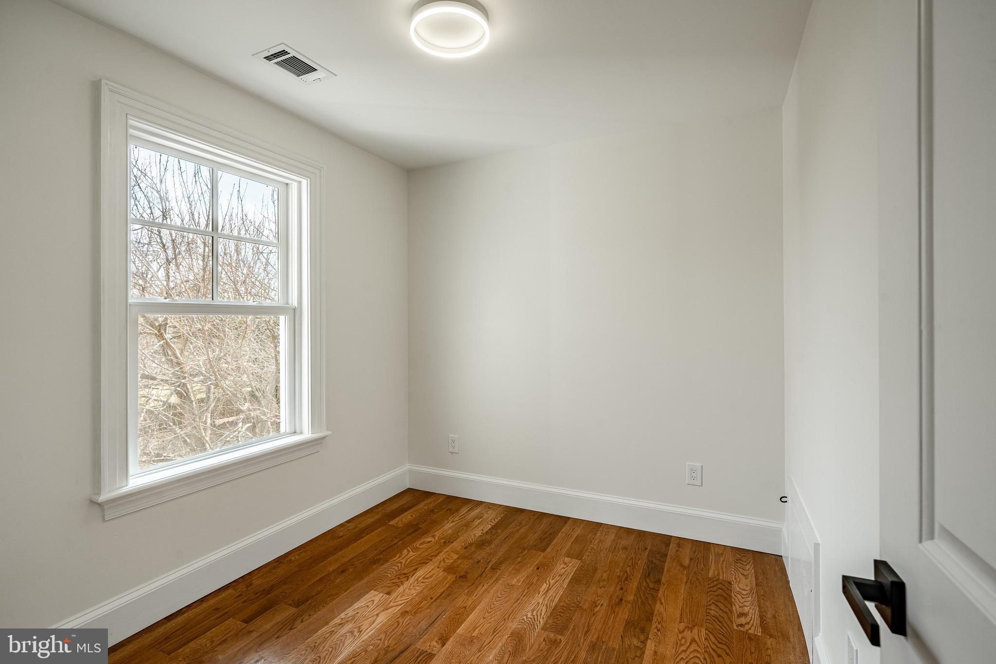 370 Boot Road West Chester, PA 19380 - Photo 27 of 56 a view of an empty room with wooden floor and a window
