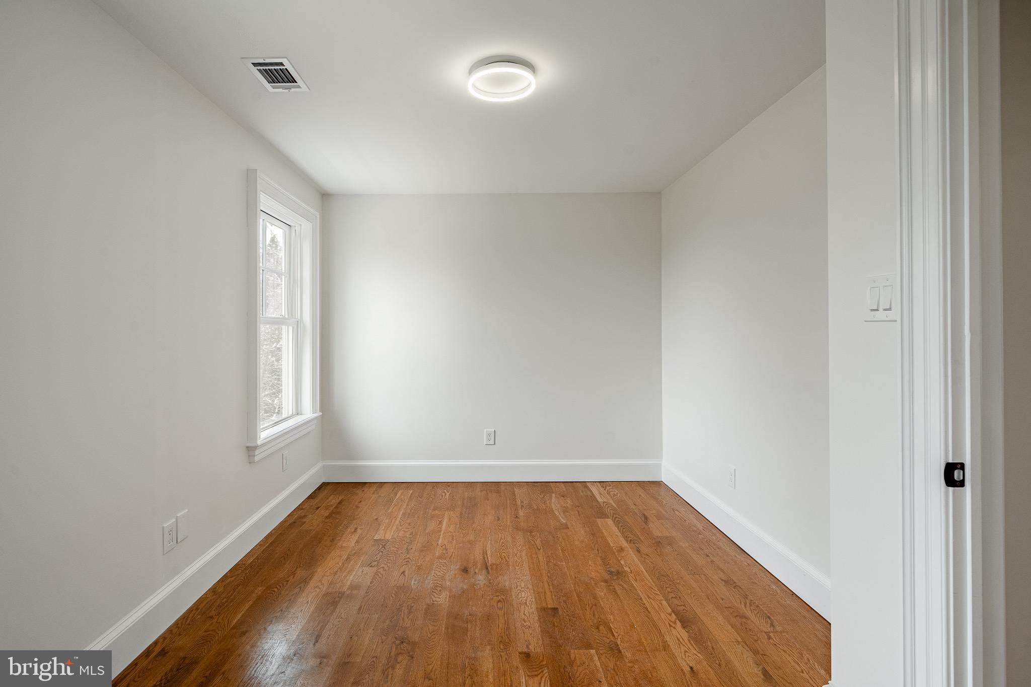 370 Boot Road West Chester, PA 19380 - Photo 28 of 56 an empty room with wooden floor and windows