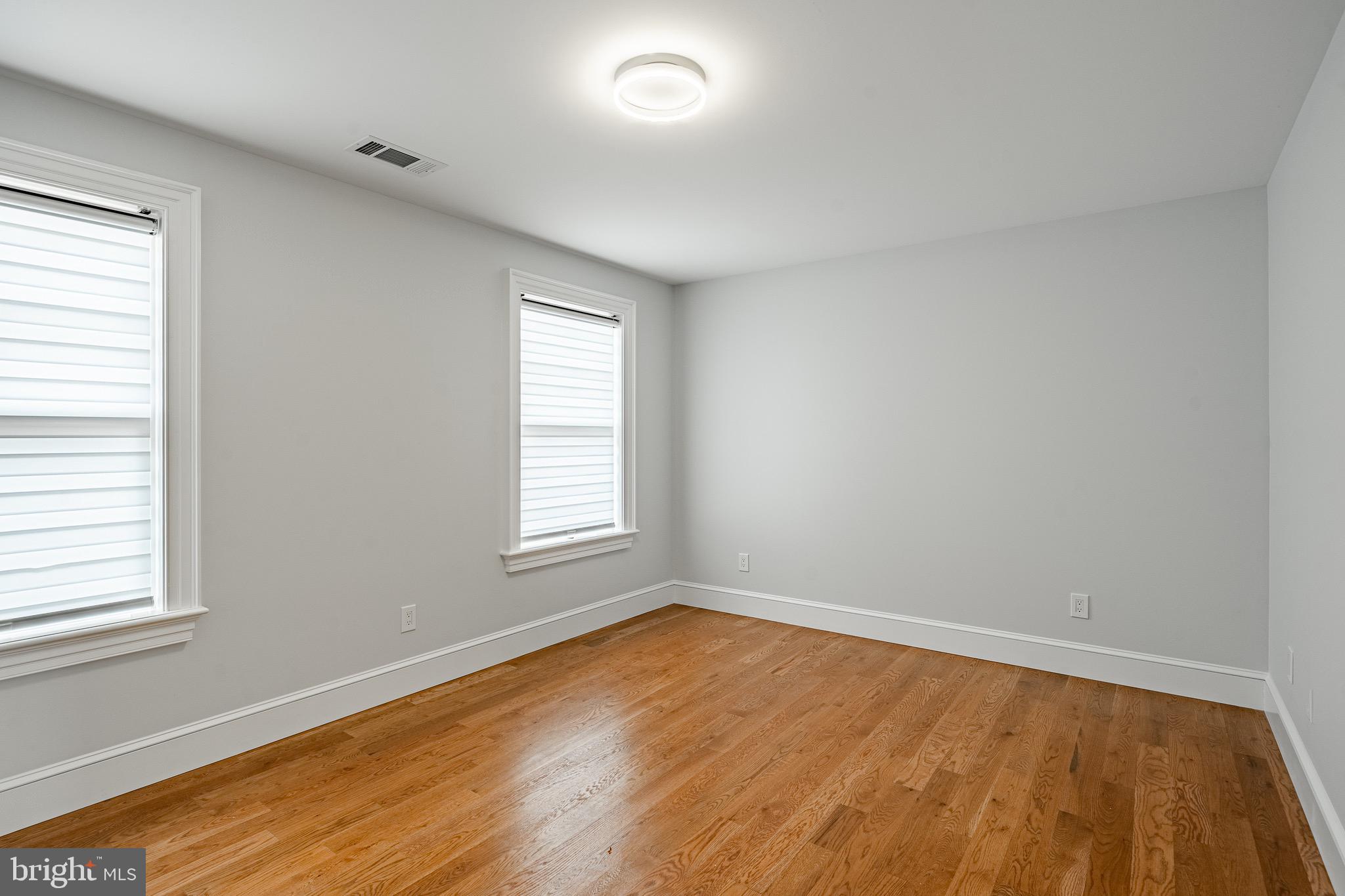 370 Boot Road West Chester, PA 19380 - Photo 34 of 56 an empty room with wooden floor and windows