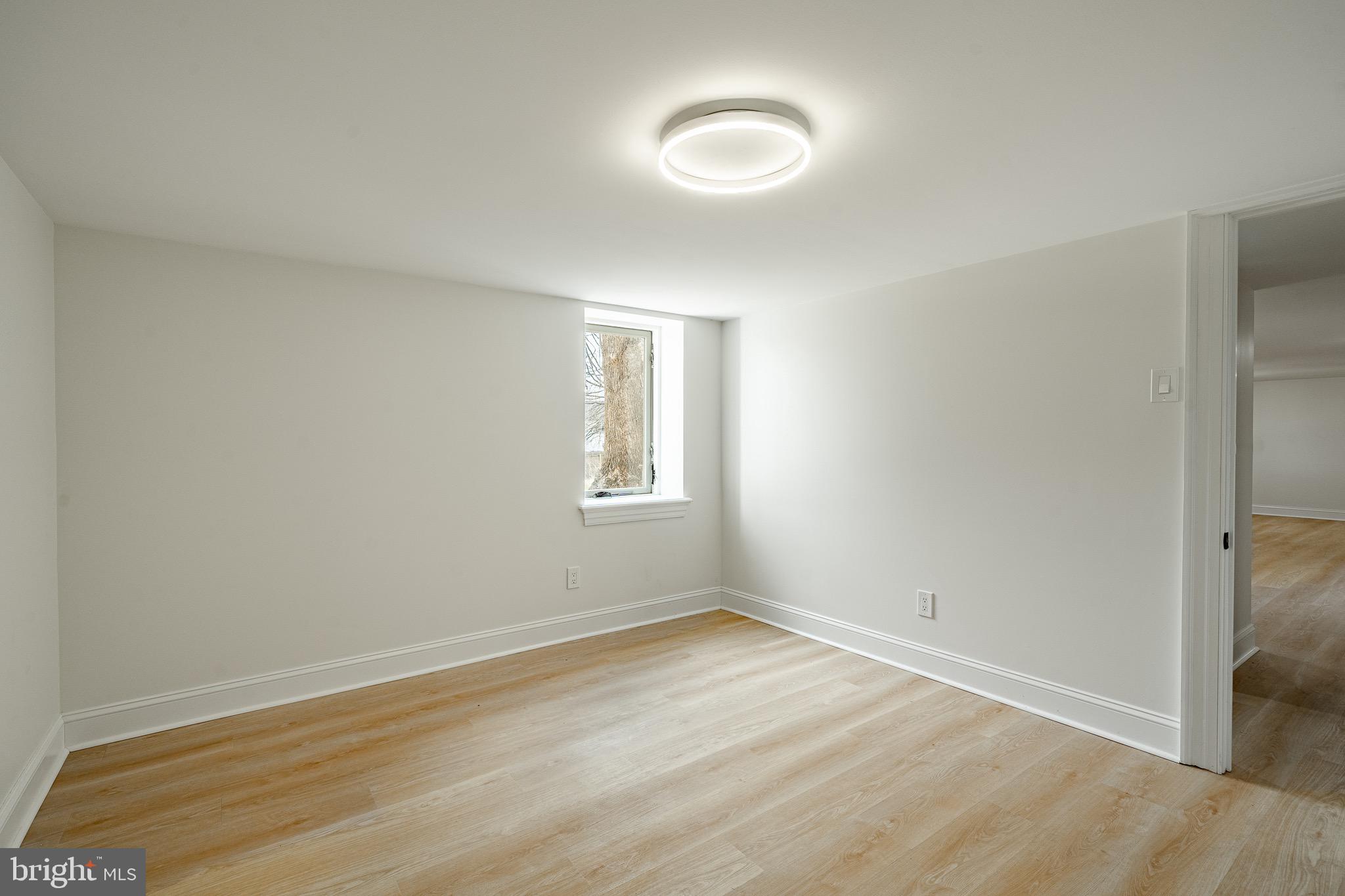 370 Boot Road West Chester, PA 19380 - Photo 39 of 56 an empty room with wooden floor and windows