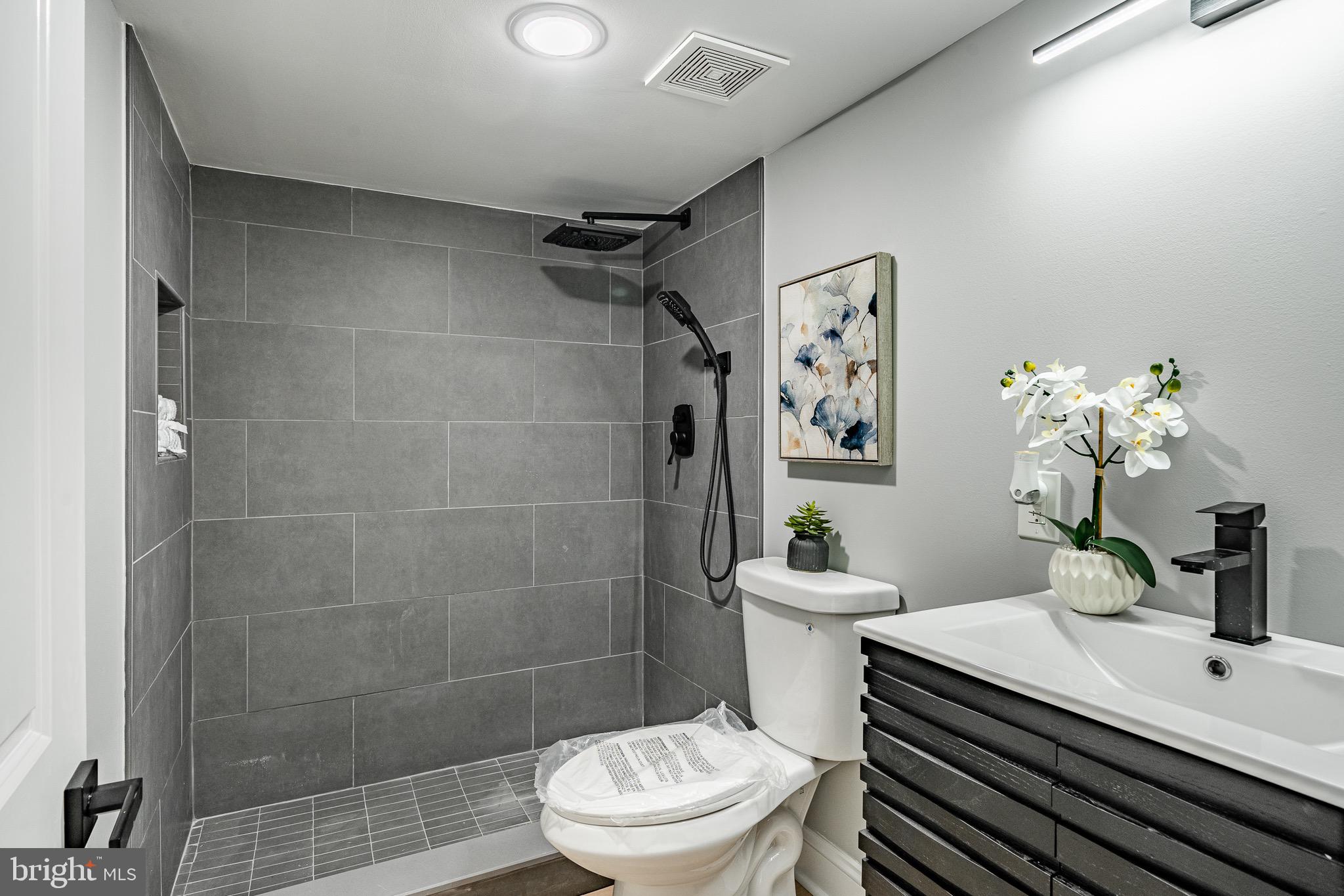 370 Boot Road West Chester, PA 19380 - Photo 40 of 56 a bathroom with a sink a toilet a mirror and shower
