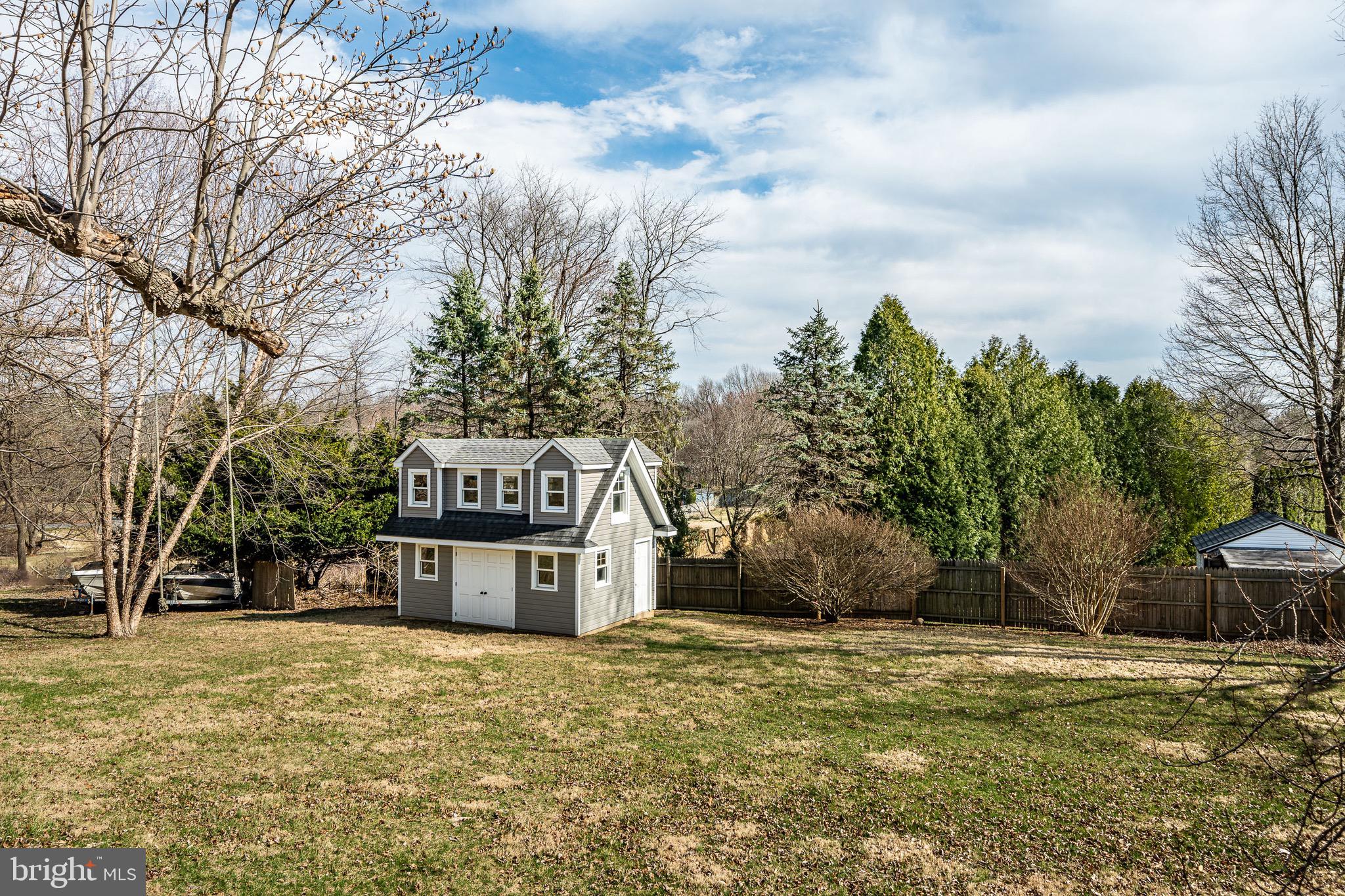 370 Boot Road West Chester, PA 19380 - Photo 51 of 56 a front view of a house with a yard and garage