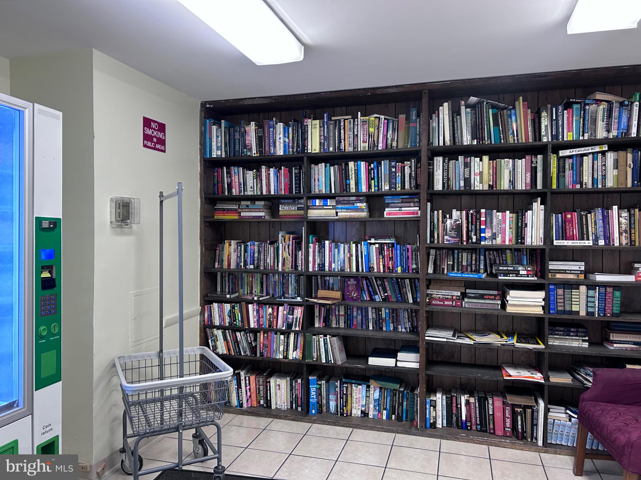 1111 University Boulevard West, Unit 1411A Silver Spring, MD 20902 - Photo 33 of 36 a view of a book shelf with lots of books