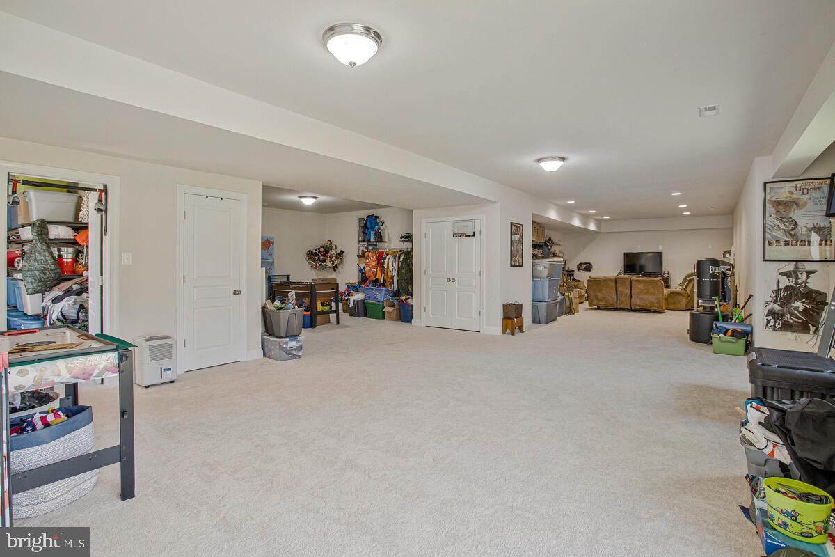 54 Simmons Ridge Road Prince Frederick, MD 20678 - Photo 41 of 55 a room with furniture and a gym equipment