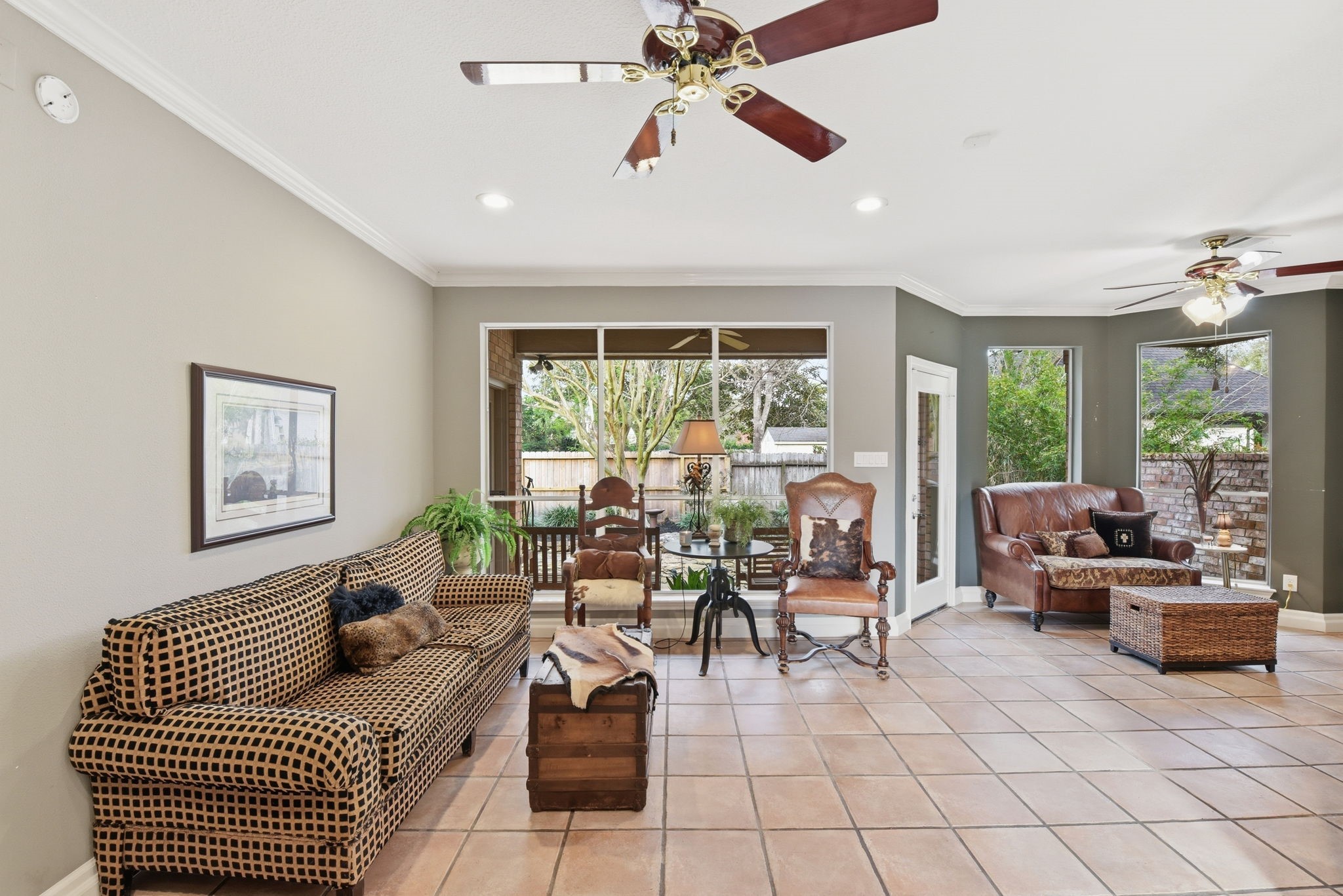 16322 Cranwood Drive Spring, TX 77379 - Photo 11 of 42 This inviting den features two distinct sitting areas, perfect for entertaining guests in a warm and stylish setting.