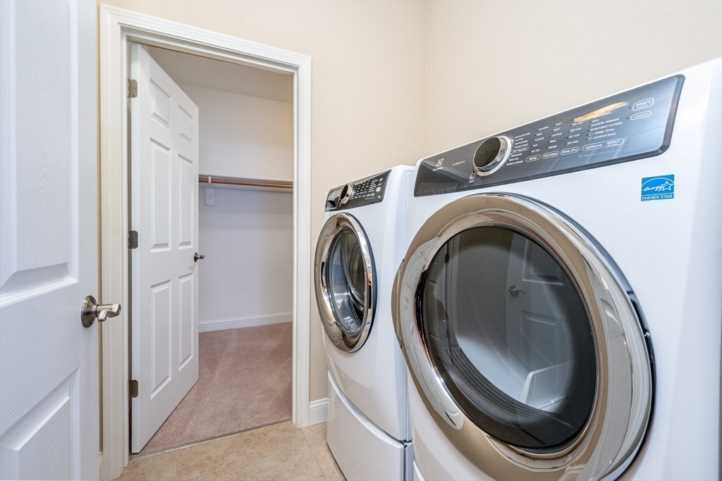 24 Grey Hawk Drive, Unit 646 Mashpee, MA 02649 - Photo 15 of 24 a utility room with dryer and washer
