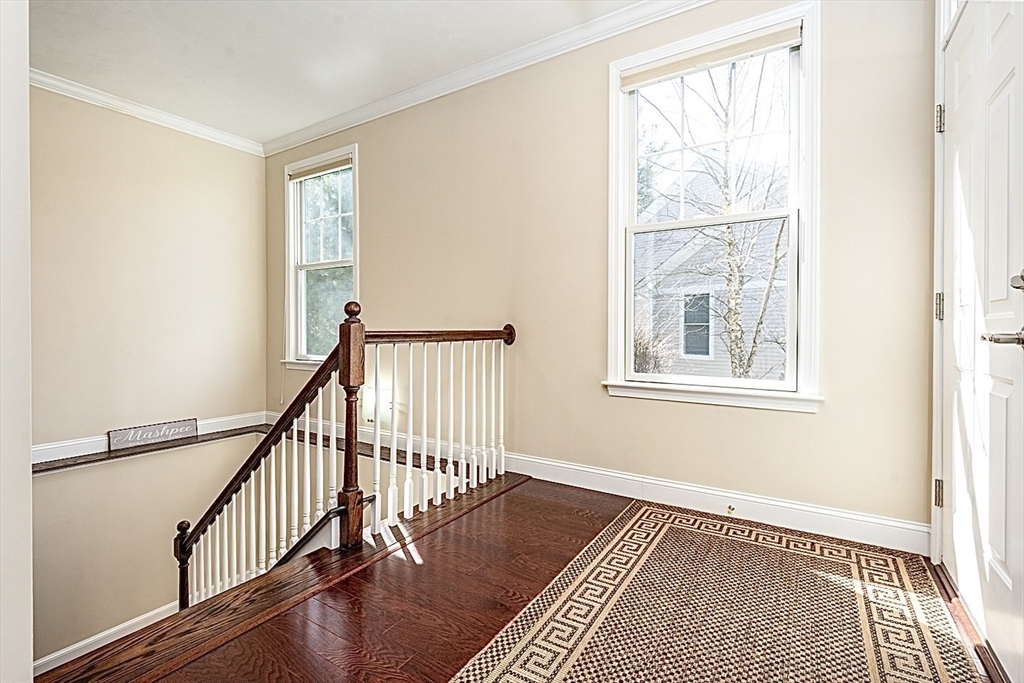 24 Grey Hawk Drive, Unit 646 Mashpee, MA 02649 - Photo 20 of 24 a view of an empty room with wooden floor and a window