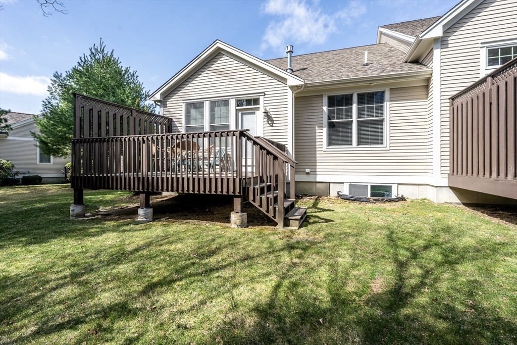 24 Grey Hawk Drive, Unit 646 Mashpee, MA 02649 - Photo 23 of 24 a view of house with backyard and deck