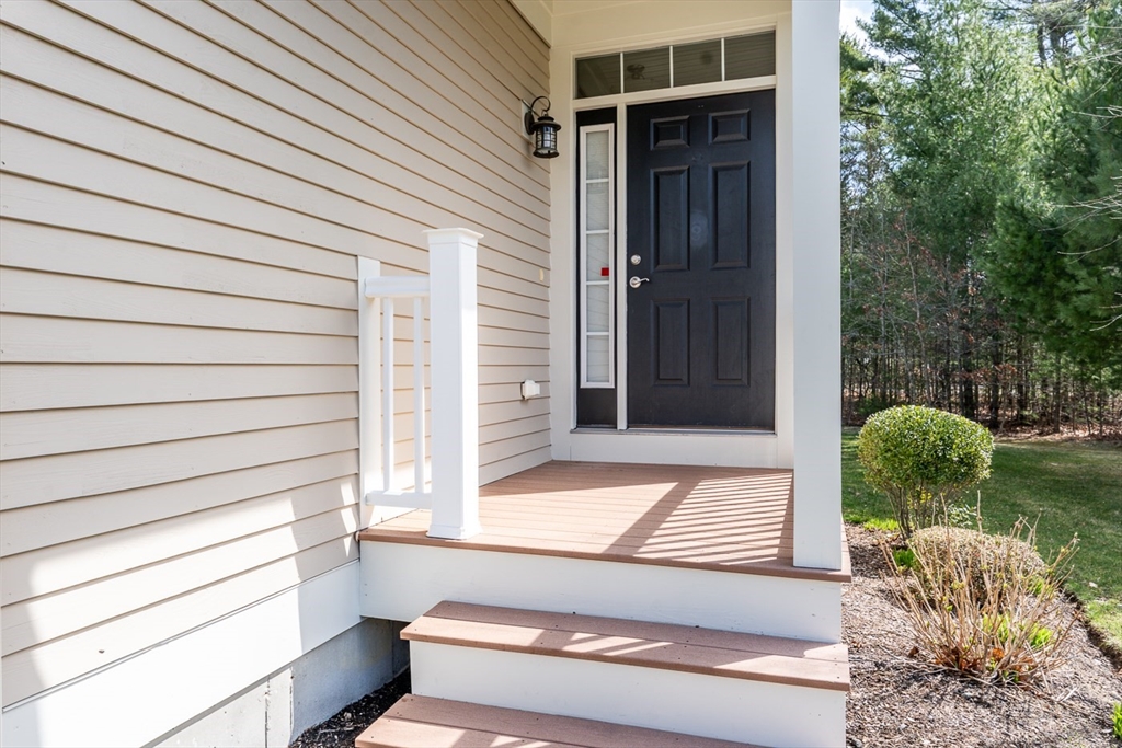 24 Grey Hawk Drive, Unit 646 Mashpee, MA 02649 - Photo 3 of 24 a view of house with backyard and outdoor seating