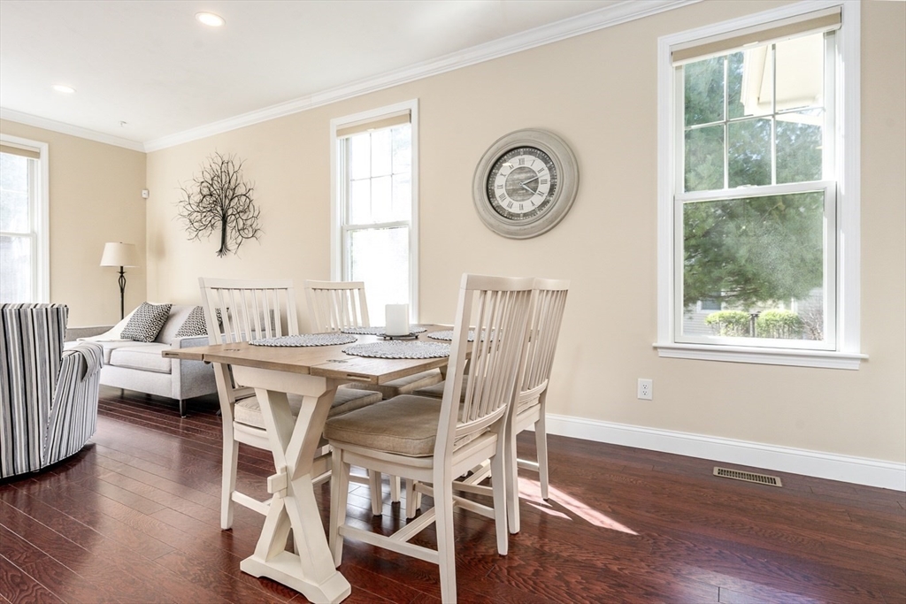 24 Grey Hawk Drive, Unit 646 Mashpee, MA 02649 - Photo 8 of 24 a view of a dining room with furniture window and wooden floor