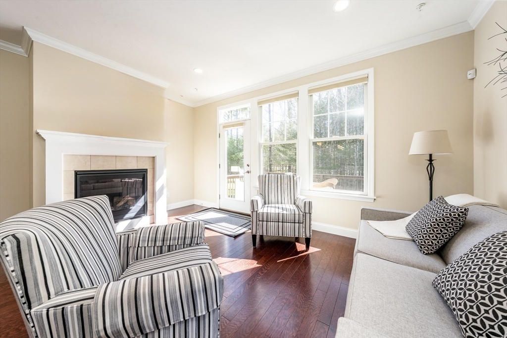 24 Grey Hawk Drive, Unit 646 Mashpee, MA 02649 - Photo 9 of 24 a living room with furniture and a large window