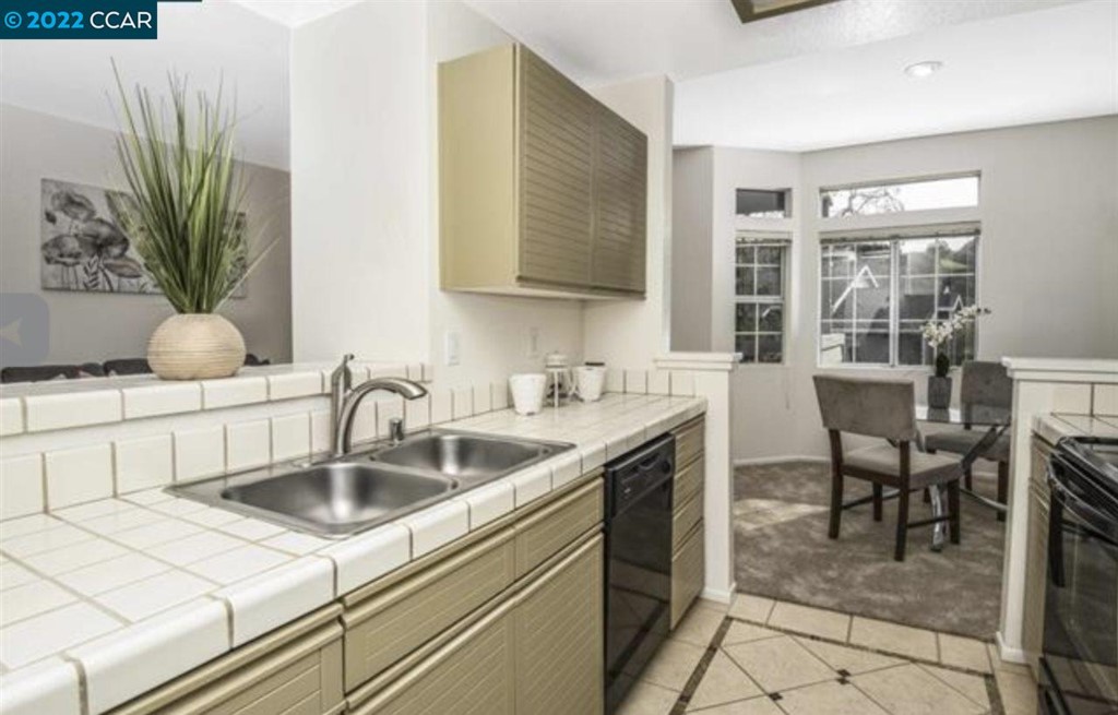 7650 Canyon Meadows Circle Pleasanton, CA 94588 - Photo 13 of 24 a kitchen with a sink and a refrigerator