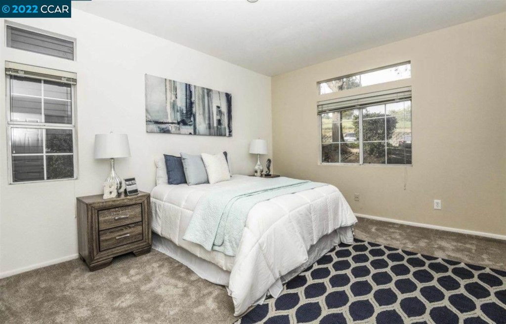 7650 Canyon Meadows Circle Pleasanton, CA 94588 - Photo 17 of 24 a bedroom with a bed and a window